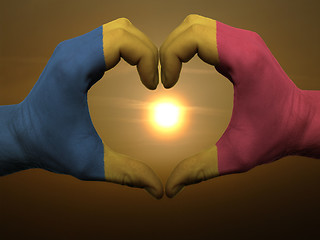 Image showing Heart and love gesture by hands colored in romania flag during b