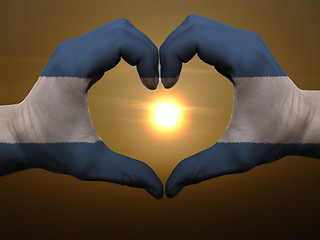 Image showing Heart and love gesture by hands colored in nicaragua flag during