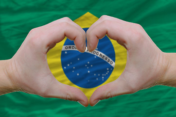 Image showing Heart and love gesture showed by hands over flag of brazil backg