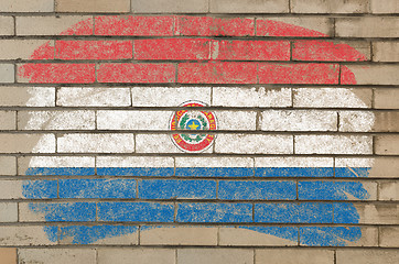 Image showing flag of paraguay on grunge brick wall painted with chalk  