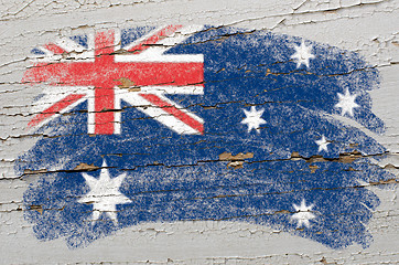 Image showing flag of Australia on grunge wooden texture painted with chalk  