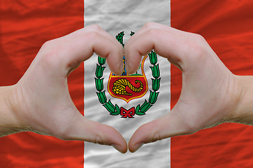 Image showing Heart and love gesture showed by hands over flag of peru backgro