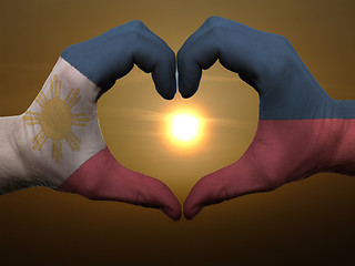 Image showing Heart and love gesture by hands colored in phillipines flag duri