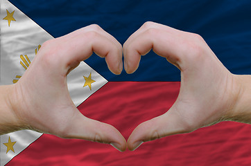 Image showing Heart and love gesture showed by hands over flag of phillipines 