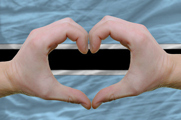 Image showing Heart and love gesture showed by hands over flag of botswana bac