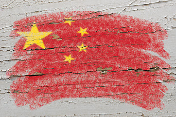 Image showing flag of China on grunge wooden texture painted with chalk  