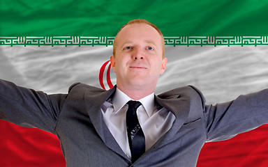 Image showing happy businessman because of profitable investment in iran stand