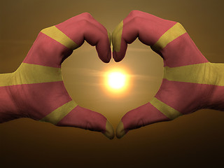 Image showing Heart and love gesture by hands colored in macedonia flag during