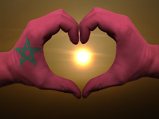 Image showing Heart and love gesture by hands colored in morocco flag during b