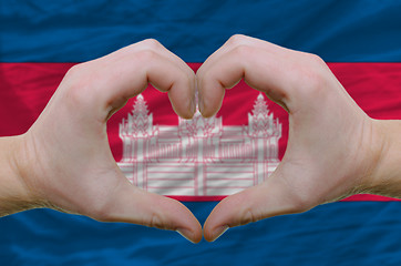 Image showing Heart and love gesture showed by hands over flag of cambodia bac