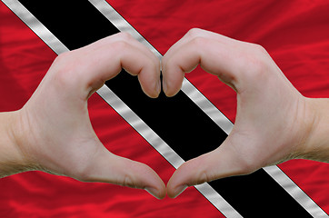 Image showing Heart and love gesture showed by hands over flag of trinidad tob