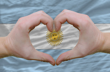 Image showing Heart and love gesture showed by hands over flag of Argentina ba