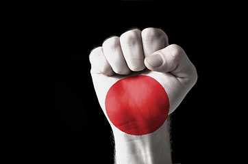 Image showing Fist painted in colors of jamaica flag