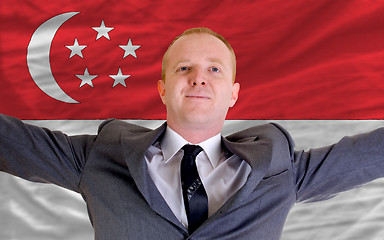 Image showing happy businessman because of profitable investment in singapore 