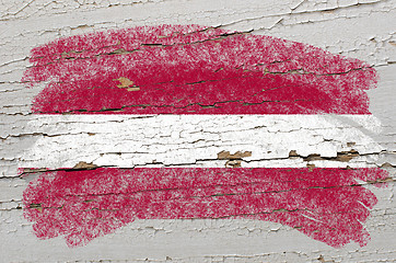 Image showing flag of latvia on grunge wooden texture painted with chalk  