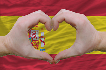 Image showing Heart and love gesture showed by hands over flag of spain backgr