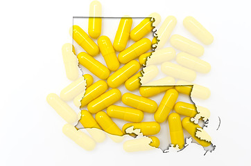 Image showing Outline map of Luisiana with transparent pills in the background