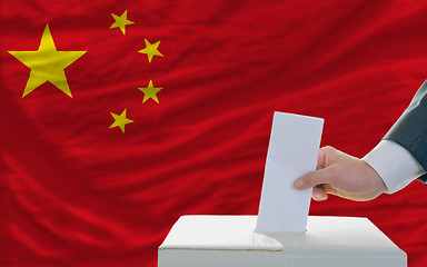 Image showing man voting on elections in china