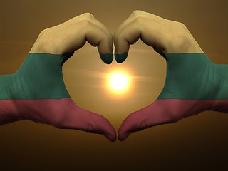 Image showing Heart and love gesture by hands colored in lithuania flag during