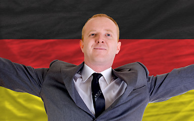 Image showing happy businessman because of profitable investment in germany st