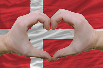 Image showing Heart and love gesture showed by hands over flag of denmark back