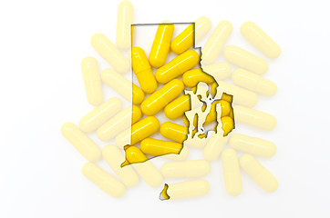 Image showing Outline map of rhode island with transparent pills in the backgr