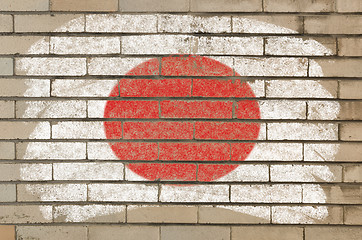 Image showing flag of Japan on grunge brick wall painted with chalk  