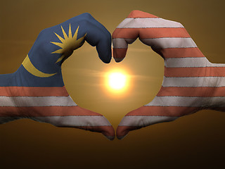 Image showing Heart and love gesture by hands colored in malaysia flag during 