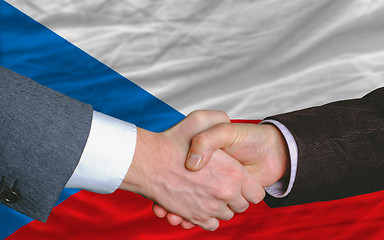 Image showing businessmen handshake after good deal in front of czech flag