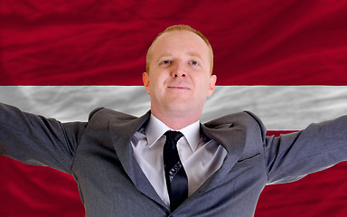 Image showing happy businessman because of profitable investment in latvia sta