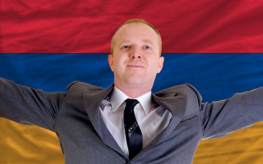 Image showing happy businessman because of profitable investment in armenia