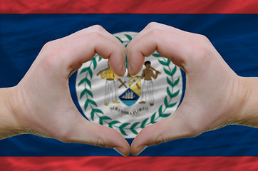 Image showing Heart and love gesture showed by hands over flag of belize backg