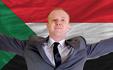 Image showing happy businessman because of profitable investment in sudan stan