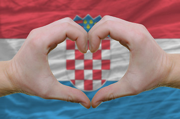 Image showing Heart and love gesture showed by hands over flag of Croatia back