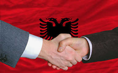 Image showing businessmen handshake after good deal in front of albania flag