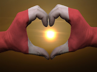 Image showing Heart and love gesture by hands colored in peru flag during beau