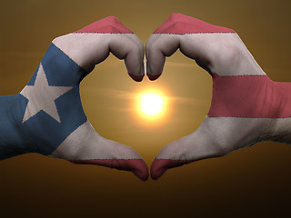 Image showing Heart and love gesture by hands colored in puertorico flag durin