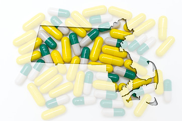 Image showing Outline map of Massachusetts with transparent pills in the backg