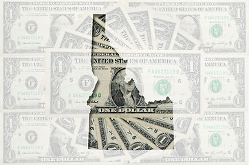 Image showing Outline map of Idaho with transparent american dollar banknotes 