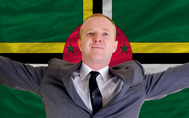 Image showing happy businessman because of profitable investment in dominica s