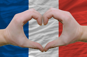 Image showing Heart and love gesture showed by hands over flag of france backg