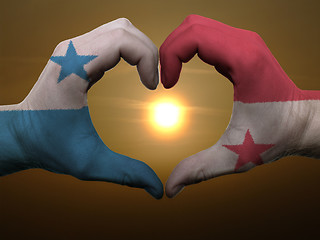 Image showing Heart and love gesture by hands colored in panama flag during be