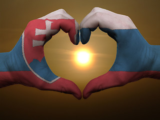 Image showing Heart and love gesture by hands colored in slovakia flag during 