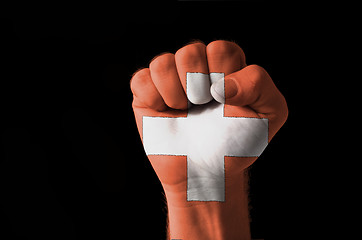 Image showing Fist painted in colors of schwitzerland flag