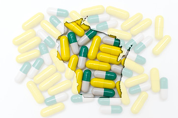 Image showing Outline map of wisconsin with transparent pills in the backgroun