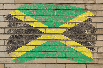 Image showing flag of jamaica on grunge brick wall painted with chalk  