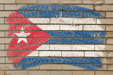 Image showing flag of Cuba on grunge brick wall painted with chalk  
