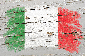 Image showing flag of Italy on grunge wooden texture painted with chalk  