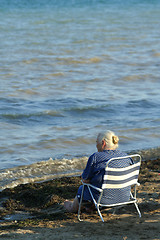 Image showing Elderly lady on a seaside