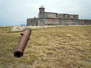 Image showing Rusty gun and fortress